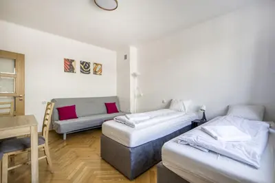 Łóżko lub łóżka w pokoju w obiekcie Labo Apartament Hala Koszyki