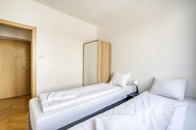 Łóżko lub łóżka w pokoju w obiekcie Labo Apartament Hala Koszyki