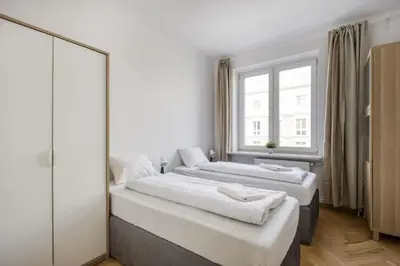 Łóżko lub łóżka w pokoju w obiekcie Labo Apartament Hala Koszyki