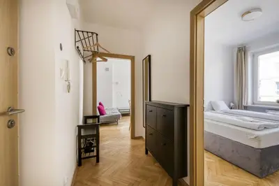 Łóżko lub łóżka w pokoju w obiekcie Labo Apartament Hala Koszyki