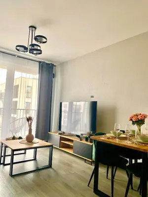 Telewizja i/lub zestaw kina domowego w obiekcie Modern & Cozy Apartment in Warsaw in Perfect Location