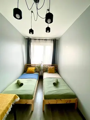 Łóżko lub łóżka w pokoju w obiekcie Modern & Cozy Apartment in Warsaw in Perfect Location