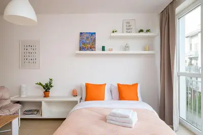 Łóżko lub łóżka w pokoju w obiekcie Liwiecka Bright Studio by BookingHost