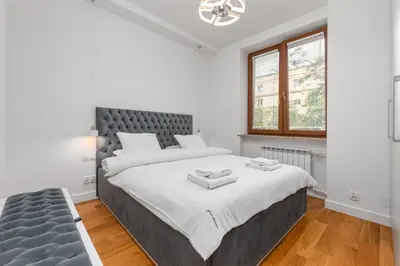Łóżko lub łóżka w pokoju w obiekcie Apartament Marszałkowska 28 by Your Freedom