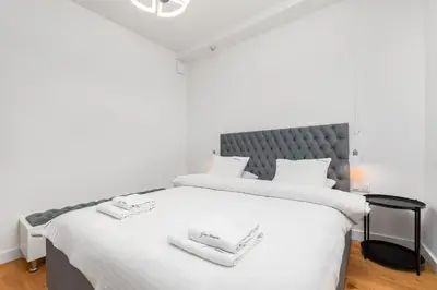 Łóżko lub łóżka w pokoju w obiekcie Apartament Marszałkowska 28 by Your Freedom