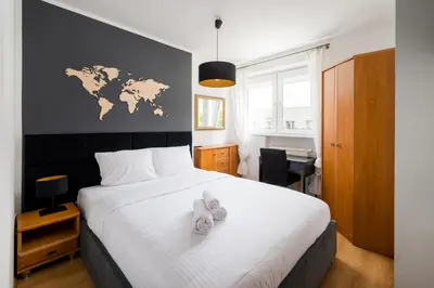 Łóżko lub łóżka w pokoju w obiekcie Park Moczydło Comfort Apartment by BookingHost