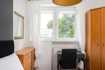 Łóżko lub łóżka w pokoju w obiekcie Park Moczydło Comfort Apartment by BookingHost