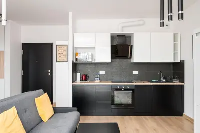 Kuchnia lub aneks kuchenny w obiekcie Wola Gumińska Comfort Apartment by BookingHost