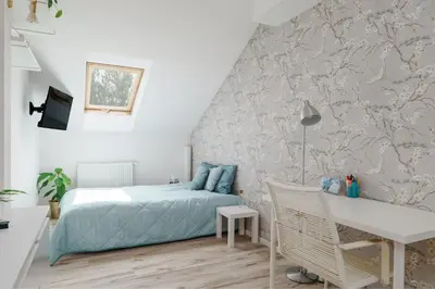 Łóżko lub łóżka w pokoju w obiekcie Cozy Attic
