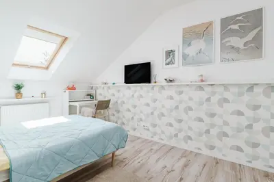 Telewizja i/lub zestaw kina domowego w obiekcie Cozy Attic