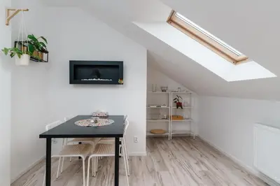 Telewizja i/lub zestaw kina domowego w obiekcie Cozy Attic