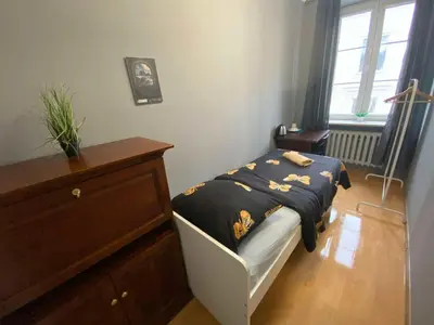 Łóżko lub łóżka w pokoju w obiekcie Fantastic-Inn Warszawa - CH16