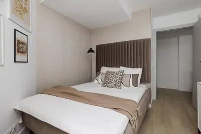 Łóżko lub łóżka w pokoju w obiekcie Kępna Lumière Apartment by Solarento