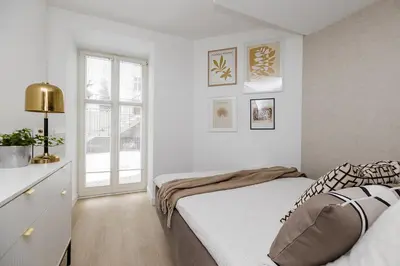 Łóżko lub łóżka w pokoju w obiekcie Kępna Lumière Apartment by Solarento
