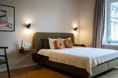 Łóżko lub łóżka w pokoju w obiekcie Warsaw Concierge Mazowiecka
