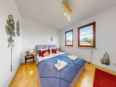 Łóżko lub łóżka w pokoju w obiekcie Urban Jungle Apartment With AC Praga Poludnie
