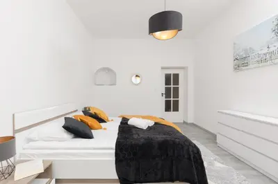 Łóżko lub łóżka w pokoju w obiekcie Metro Plac Wilsona Cozy Apartments by Noclegi Renters