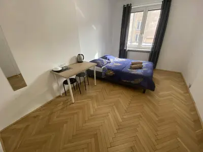 Łóżko lub łóżka w pokoju w obiekcie Fantastic-Inn Warszawa - CH10