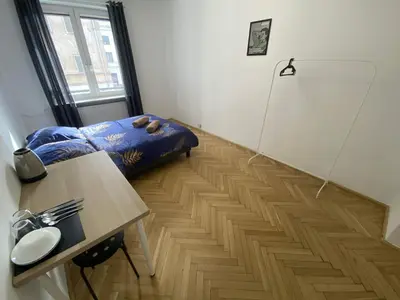 Łóżko lub łóżka w pokoju w obiekcie Fantastic-Inn Warszawa - CH10