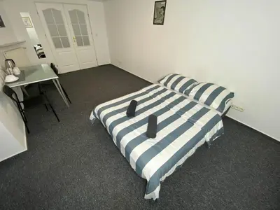 Łóżko lub łóżka w pokoju w obiekcie Fantastic-Inn Warszawa - NS42