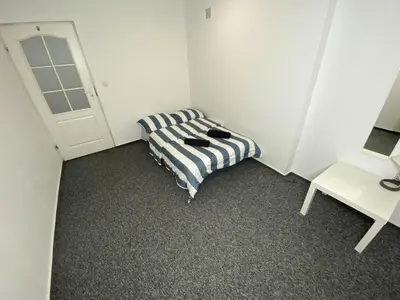Łóżko lub łóżka w pokoju w obiekcie Fantastic-Inn Warszawa - NS42