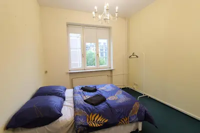 Łóżko lub łóżka w pokoju w obiekcie Fantastic-Inn Warszawa - NS42