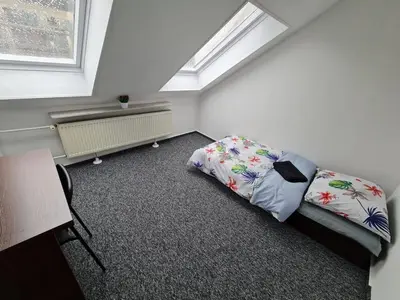 Łóżko lub łóżka w pokoju w obiekcie Fantastic-Inn Warszawa - NS42