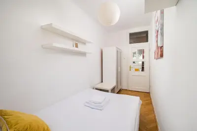 Łóżko lub łóżka w pokoju w obiekcie Park Malickiego Cozy Apartment by BookingHost