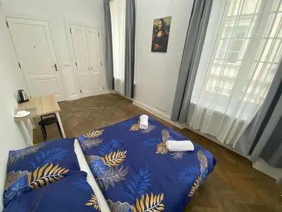 Łóżko lub łóżka w pokoju w obiekcie Fantastic-Inn Warszawa - NS51