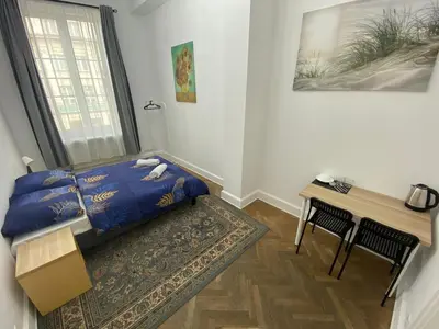 Łóżko lub łóżka w pokoju w obiekcie Fantastic-Inn Warszawa - NS51