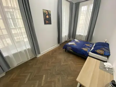Łóżko lub łóżka w pokoju w obiekcie Fantastic-Inn Warszawa - NS51