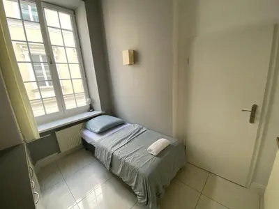 Łóżko lub łóżka w pokoju w obiekcie Fantastic-Inn Warszawa - NS51