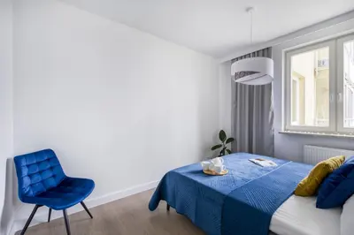 Łóżko lub łóżka w pokoju w obiekcie Św Wincentego 114 SuperApart - Z balkonem