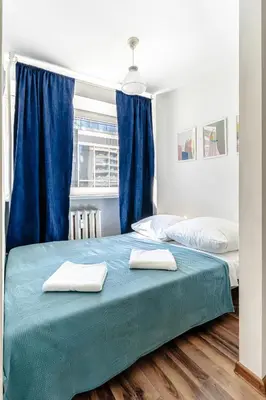 Łóżko lub łóżka w pokoju w obiekcie Chmielna str Super Central Apartment