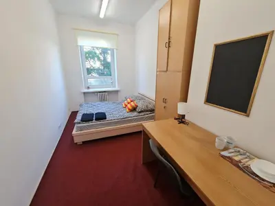 Łóżko lub łóżka w pokoju w obiekcie Fantastic-Inn Warszawa - NS27