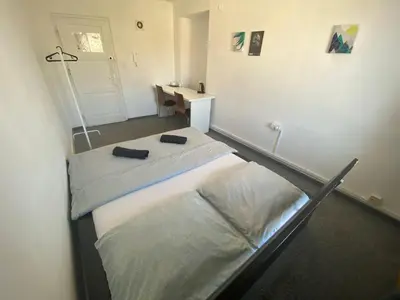 Łóżko lub łóżka w pokoju w obiekcie Fantastic-Inn Warszawa - NS27
