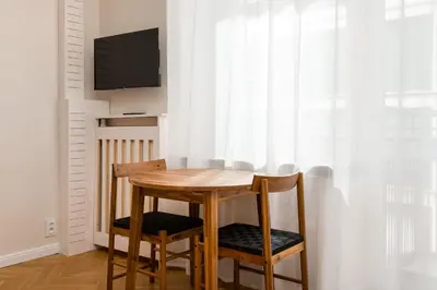 Telewizja i/lub zestaw kina domowego w obiekcie Widok Warsaw City Apartment by BookingHost
