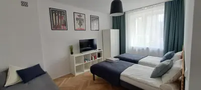 Łóżko lub łóżka w pokoju w obiekcie Klemens Apartment