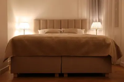 Łóżko lub łóżka w pokoju w obiekcie Awangarda