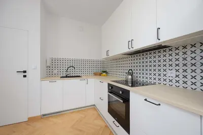 Kuchnia lub aneks kuchenny w obiekcie Stylish One Bedroom Apartment in Warsaw with Balcony by Noclegi Renters