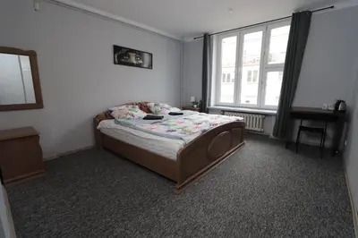 Łóżko lub łóżka w pokoju w obiekcie Fantastic-Inn Warszawa - Kopernika