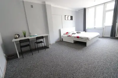 Łóżko lub łóżka w pokoju w obiekcie Fantastic-Inn Warszawa - Kopernika