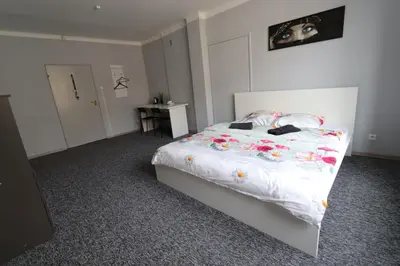 Łóżko lub łóżka w pokoju w obiekcie Fantastic-Inn Warszawa - Kopernika