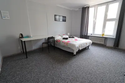 Łóżko lub łóżka w pokoju w obiekcie Fantastic-Inn Warszawa - Kopernika