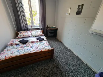 Łóżko lub łóżka w pokoju w obiekcie Fantastic-Inn Warszawa - Kopernika