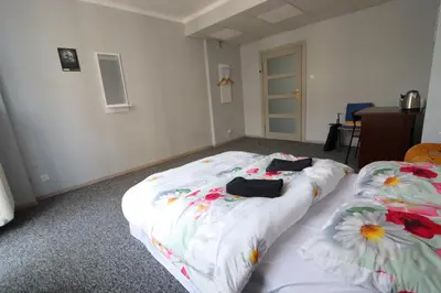 Łóżko lub łóżka w pokoju w obiekcie Fantastic-Inn Warszawa - Kopernika