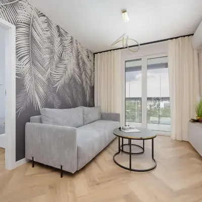 Beige Apartment in Warsaw with Parking and Air Conditioned Living Room by Noclegi Renters