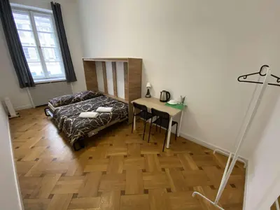 Łóżko lub łóżka w pokoju w obiekcie Fantastic-Inn Warszawa - NS38