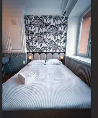 Łóżko lub łóżka w pokoju w obiekcie Center Deluxe Blue