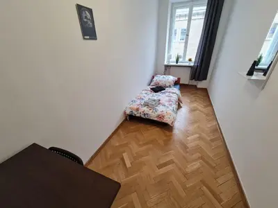 Łóżko lub łóżka w pokoju w obiekcie Fantastic-Inn Warszawa - Ordynacka